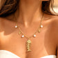 Collar largo Raspa y perlas acero